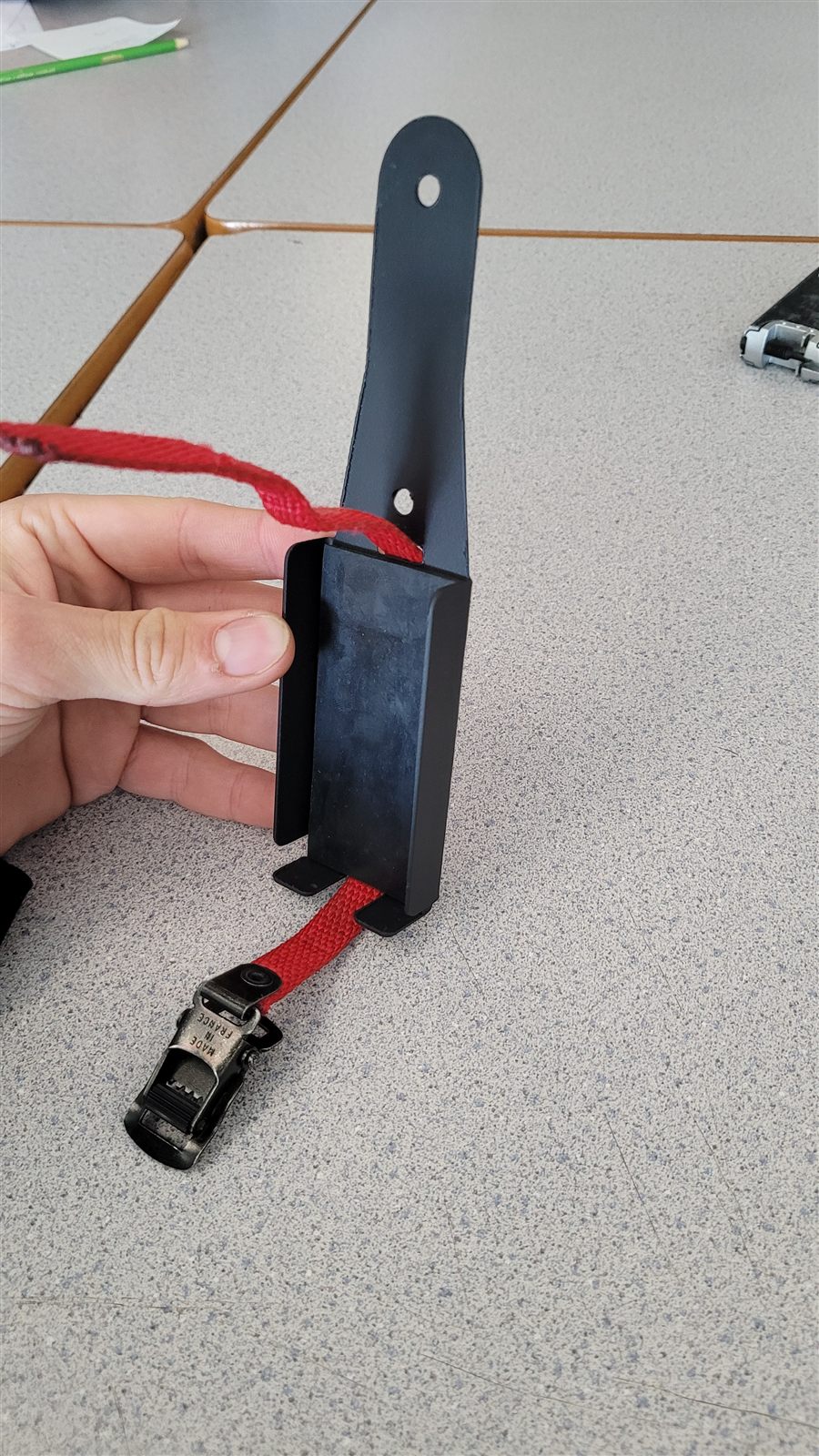 Multitool being taken out of the holder