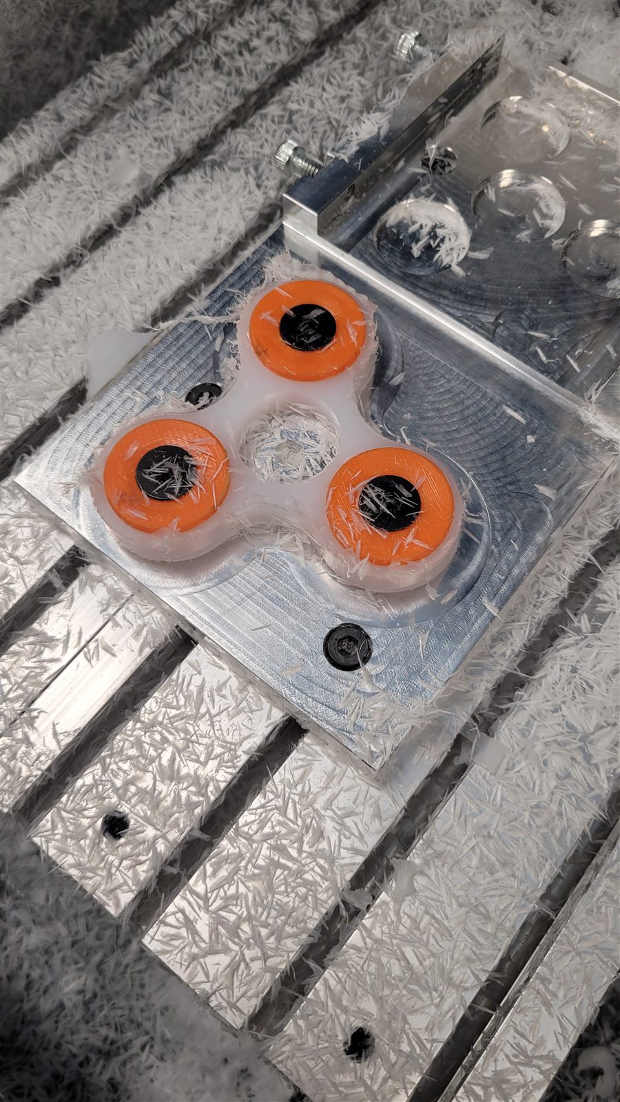 Spinner held in a fixture inside the mill