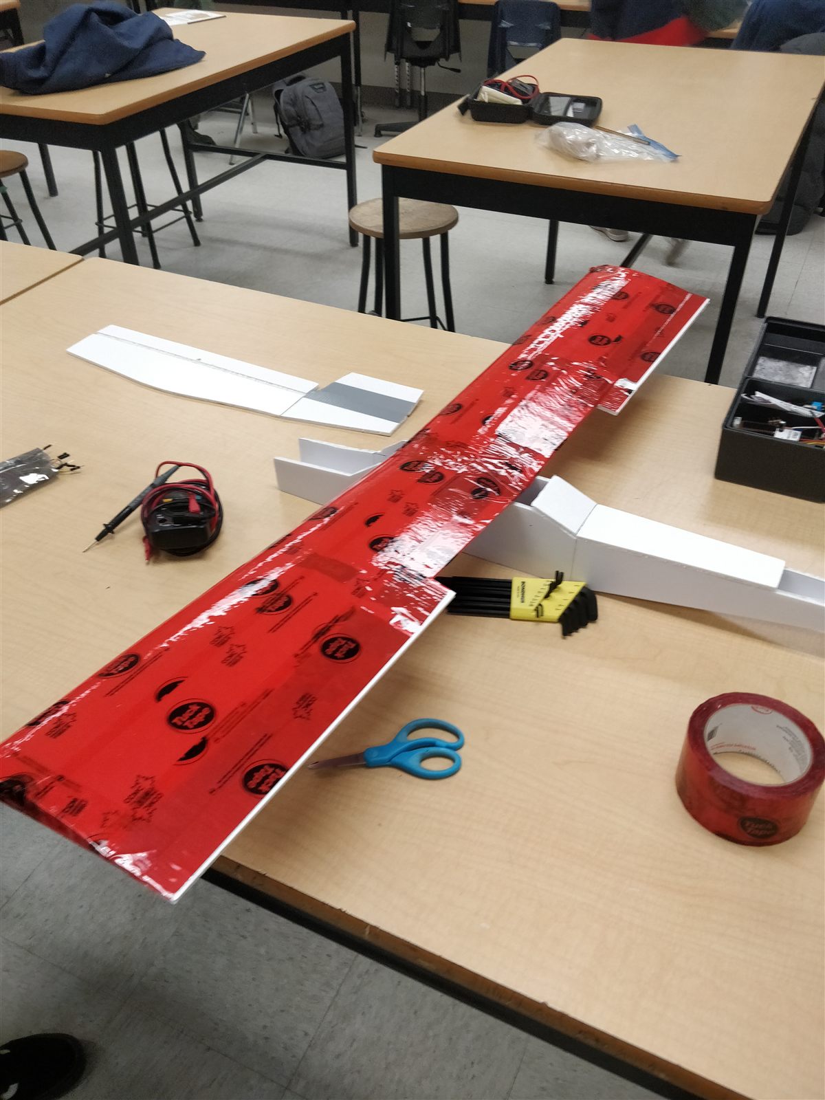 Wings covered in red tape