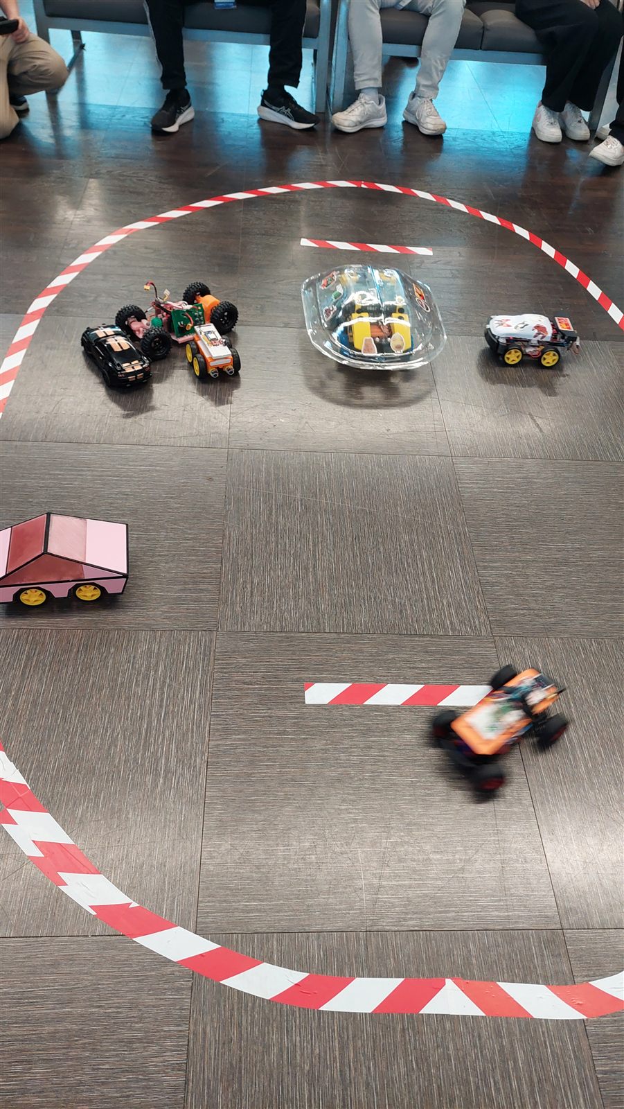 RC cars lined up at the competition